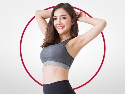 Happy young woman with dark hair wearing tank top, stretching and smiling after Canesten ringworm treatment