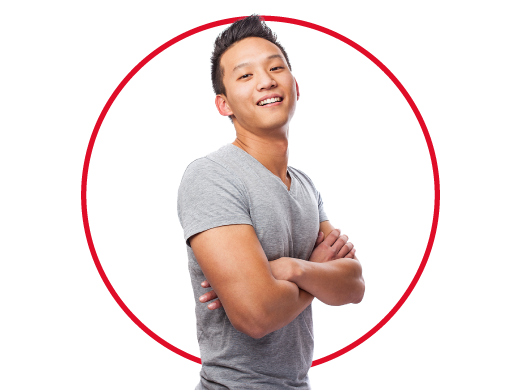 Young fashionable man standing confidently against white backdrop